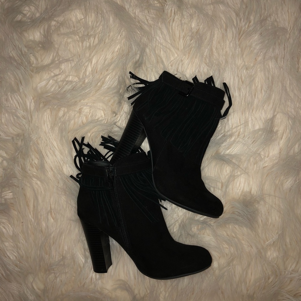 Material Girl black fringe heeled boots.